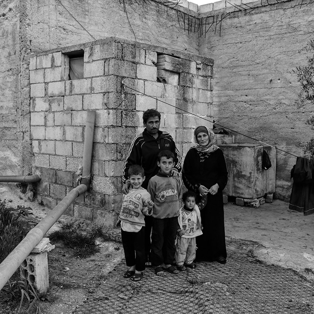 REFUGEE FAMILY PORTRAIT by Elle Toussi